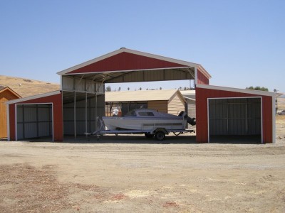 Raised Center Metal Barn | Vertical Roof | 48W x 21L x 12H |  Carolina Barn